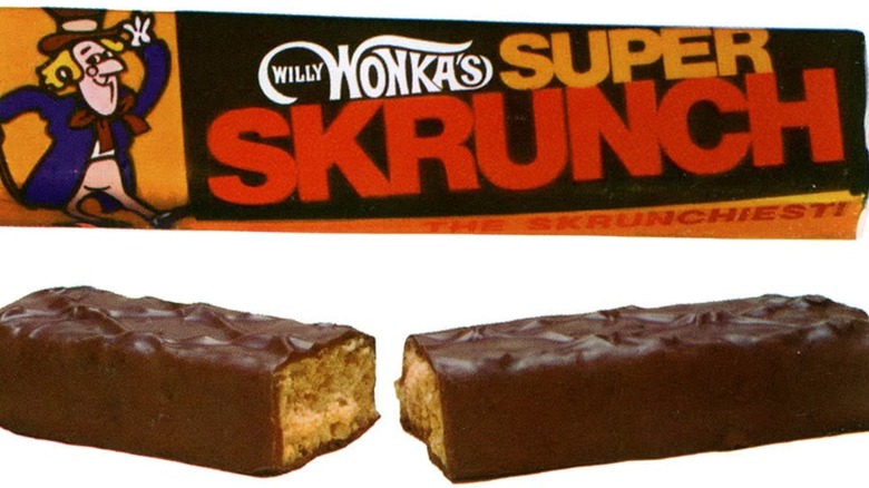 A Super Skrunch bar broken in half underneath a Super Skrunch package on a white background
