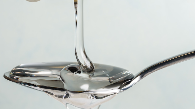 Corn syrup falling onto spoon