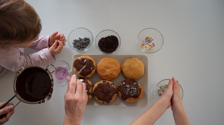Family decorating donuts
