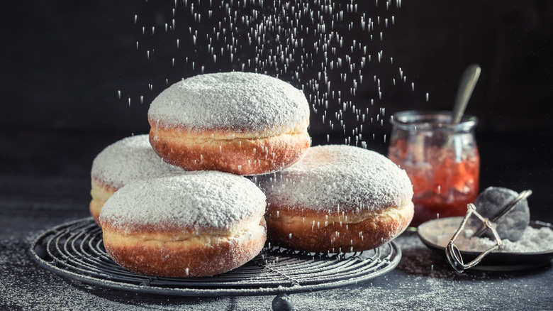 Powdered sugar falling on donuts
