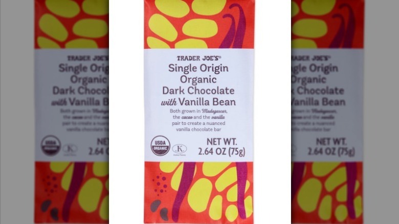 Single Origin Organic Dark Chocolate with Vanilla Bean bar with red and yellow label on white background