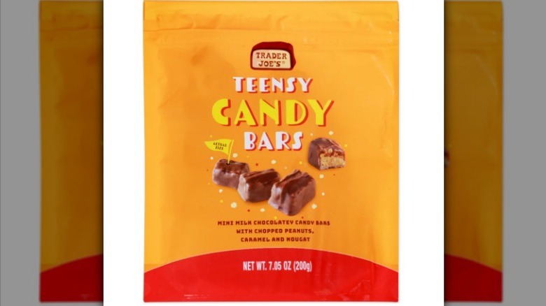 Teensy candy bars with a golden and red package on white background