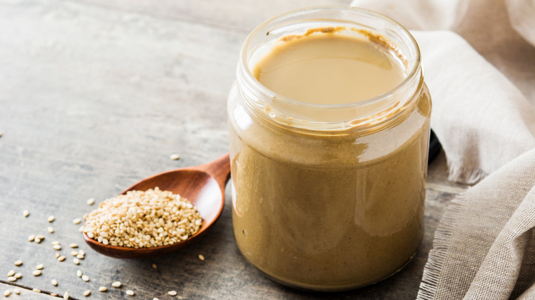 jar of tahini and sesame seeds