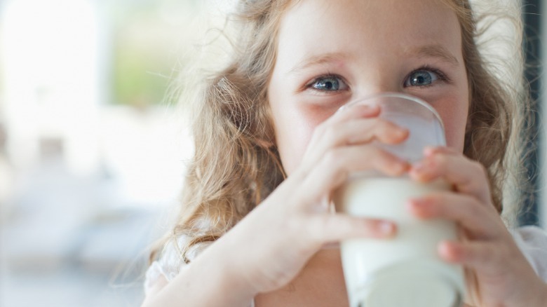 Girl drinking glass of milk
