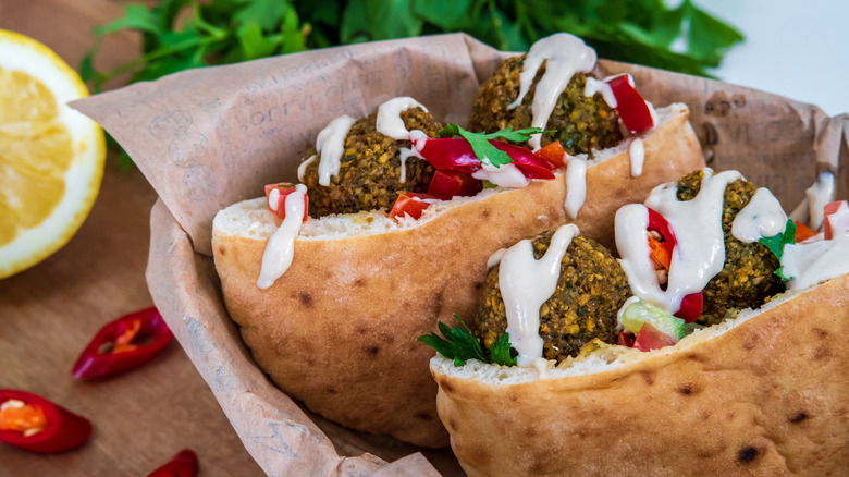 drizzled sauce on falafel