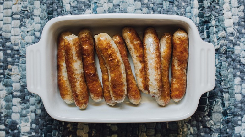 Browned sausage links in dish