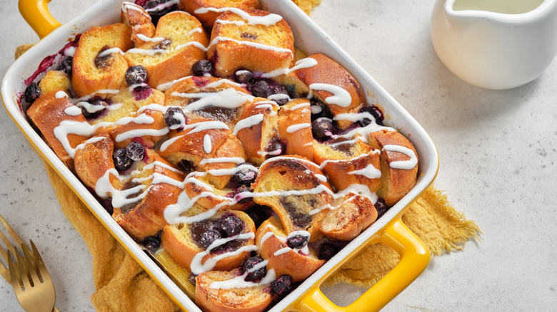 French toast casserole, topped with blueberries and an icing sugar glaze