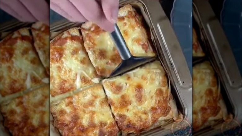 French toast breakfast lasagna, with spatula cutting out pieces