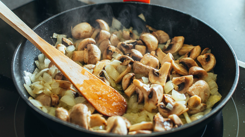 Mushrooms sautéed in pan 