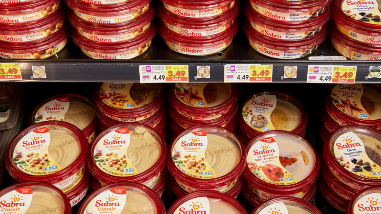 stacked containers of Sabra hummus