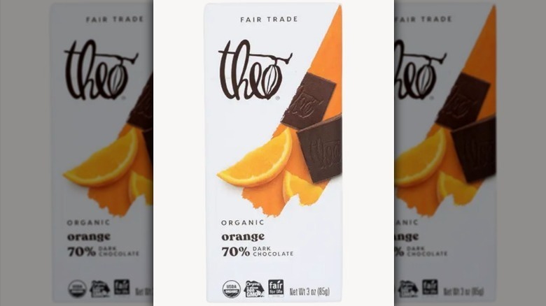 Theo orange dark chocolate bar in a white package on white background
