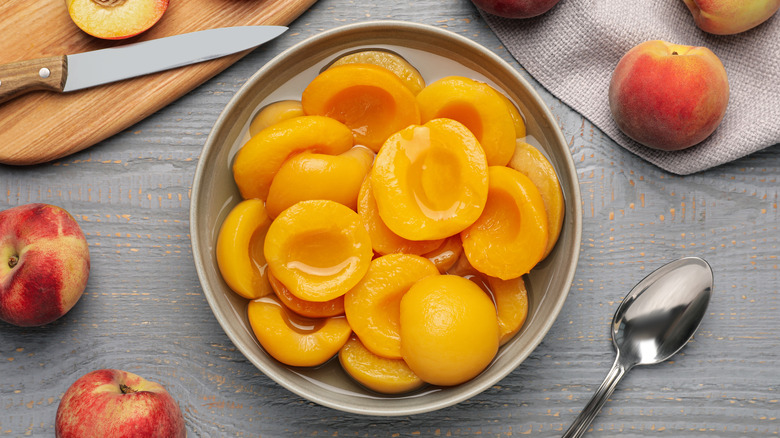 halved, peeled peaches in bowl