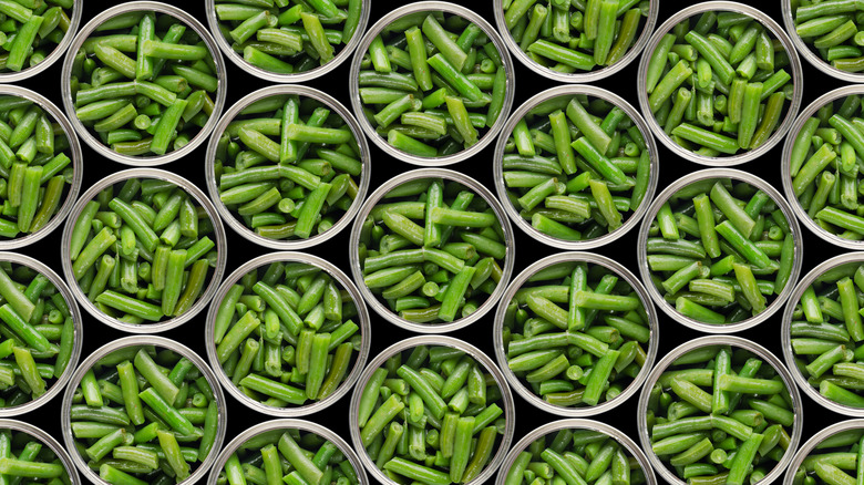 Open cans of green beans