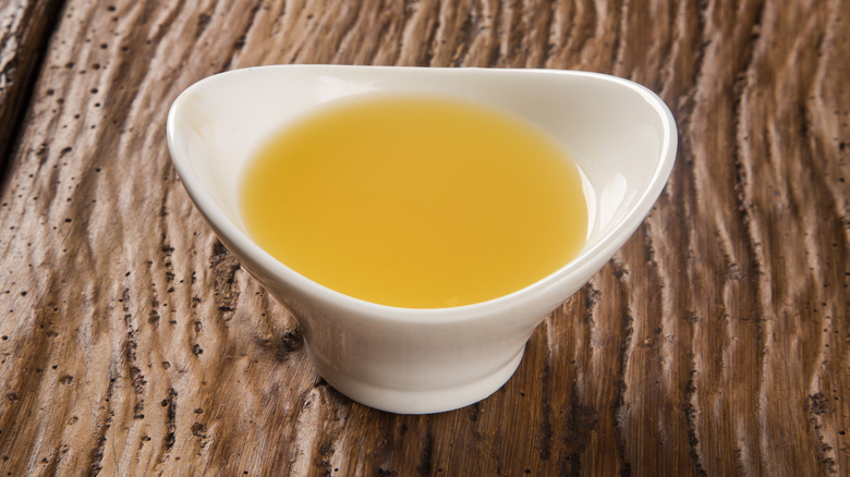 Tucupí juice in white bowl