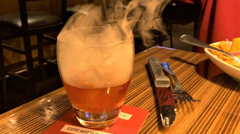 smoke rising from cocktail glass