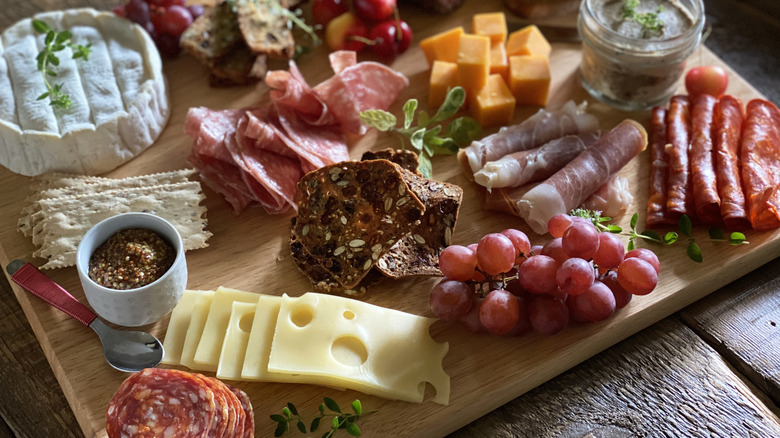 Charcuterie board with array of food