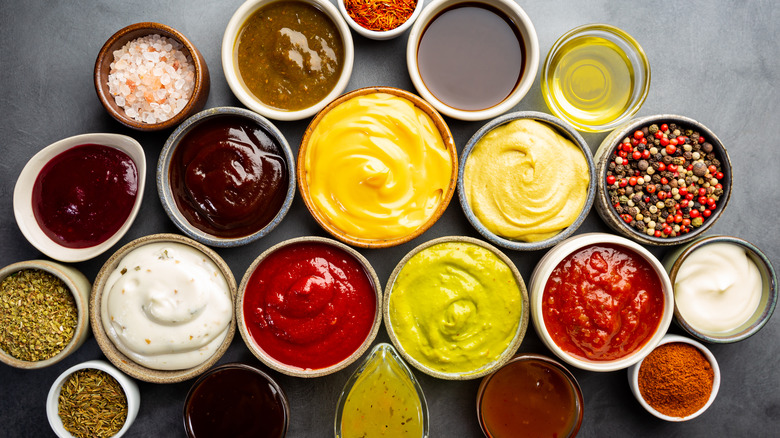 Assorted condiments in servings ramekins