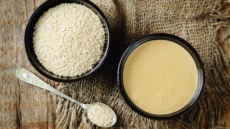 Bowls of tahini and sesame seeds