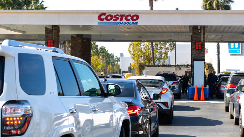 Rows of cars queue at a Costco Gasoline station