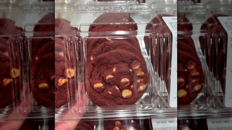 Hand holding red velvet cookies close up