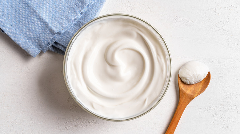 Bowl and spoon of sour cream
