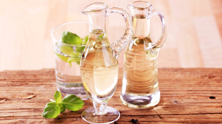 Bottles of champagne vinegar on table
