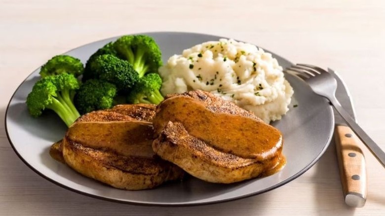 A plate of Outback Steakhouse's Caramel Mustard Glazed Pork Chops