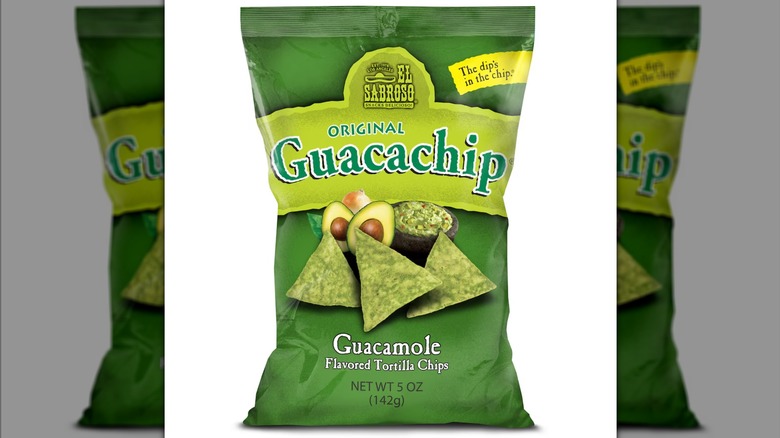 A green bag of El Saboroso Guacachip Guacamole-Flavored Tortilla Chips against a white background.