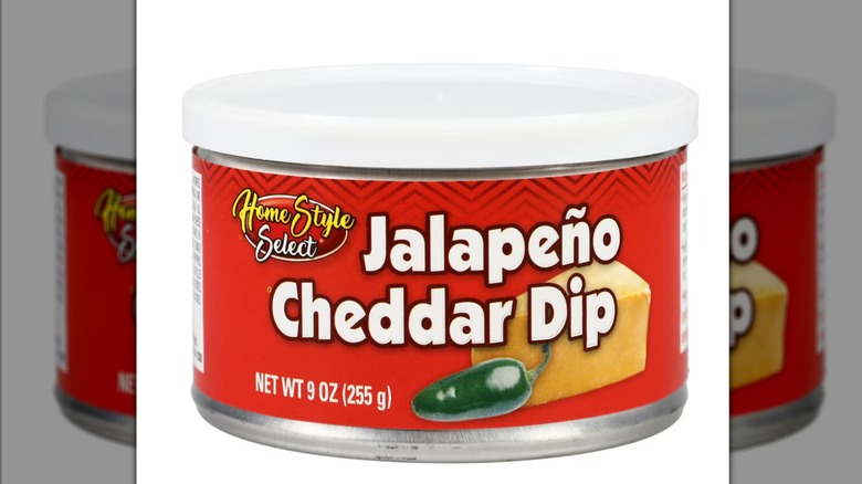 A red can of Jalapeño Cheddar Cheese Dip against a white background.