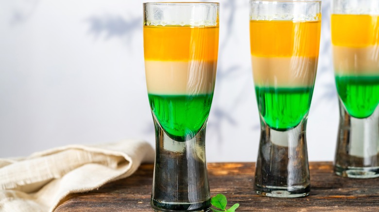 Three glasses of layered shots