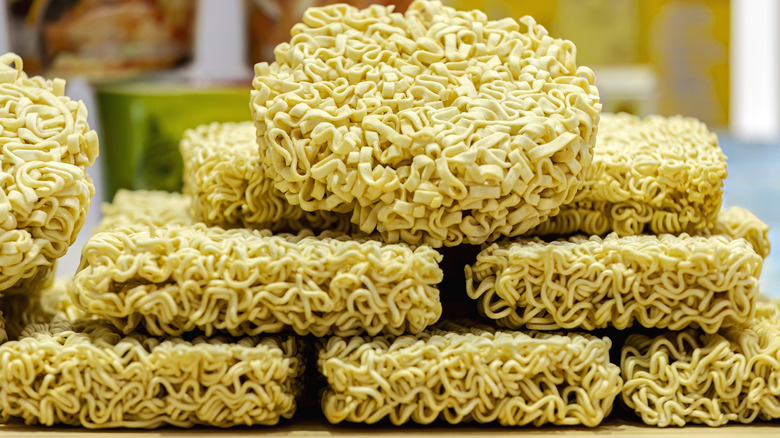 Piles of uncooked instant ramen noodles