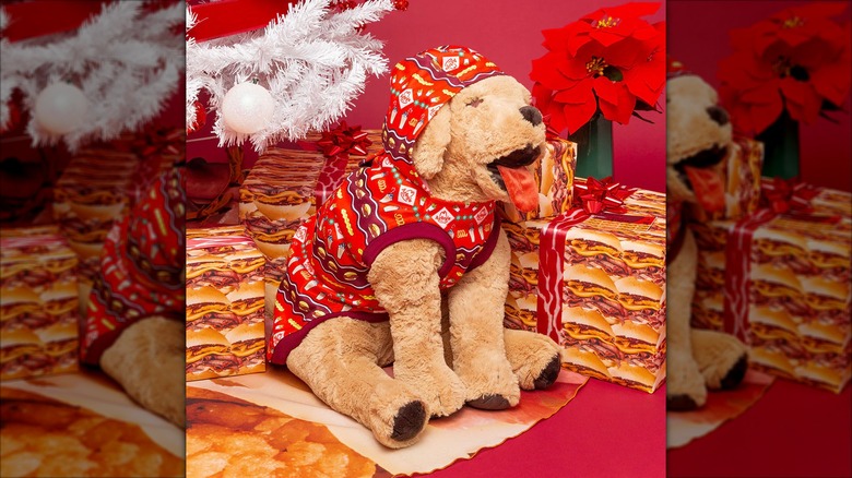 A life size stuffed dog wearing Arby's dog pajamas