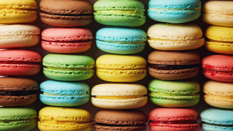 A box of many macarons of different colors in rows