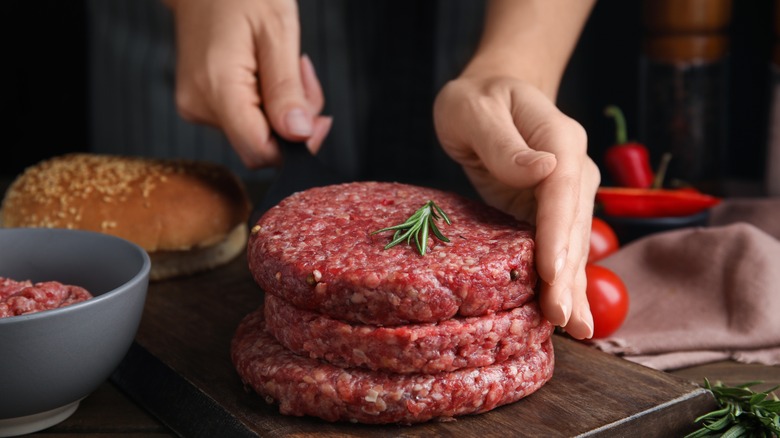 stack of raw burgers