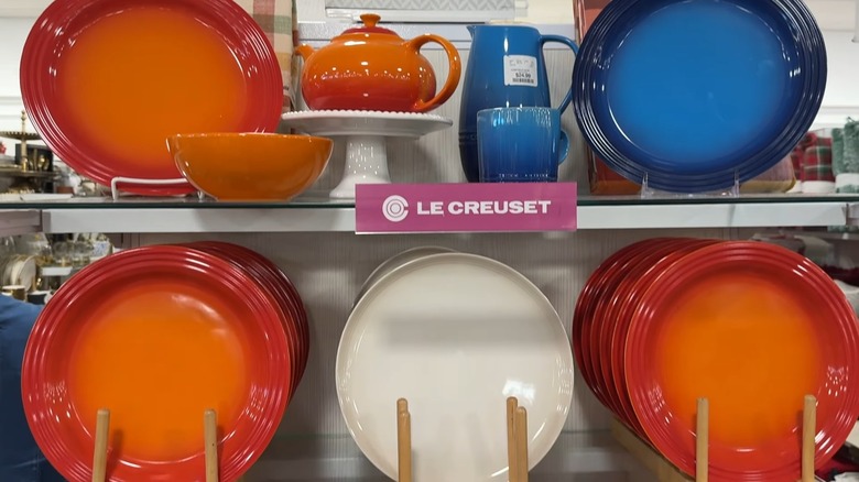 Variety of blue, orange, and cream Le Creuset dishes