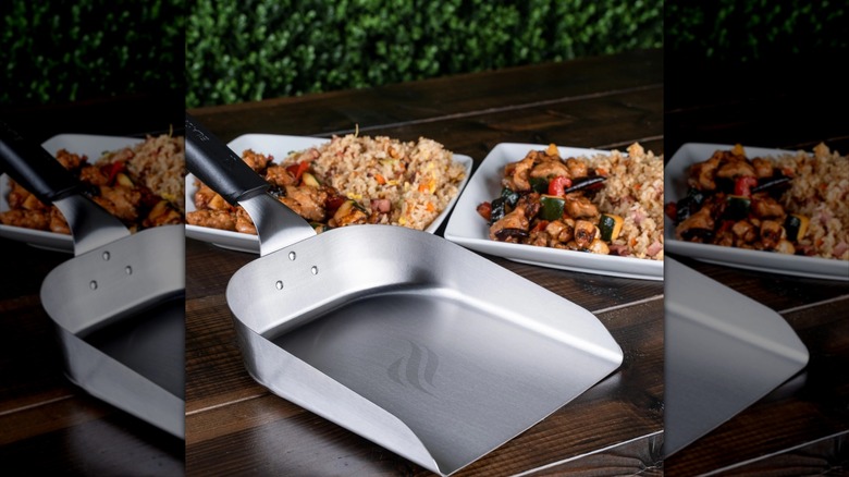 Blackstone stainless steel griddle scoop in front of dishes of food