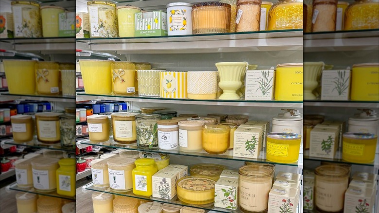 Shelves stocked with citrus and mint-scented candles