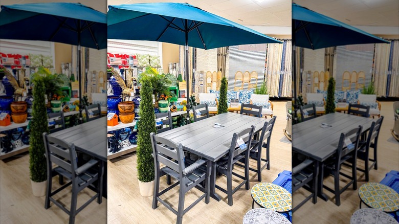 Patio dining table, chairs, and umbrella