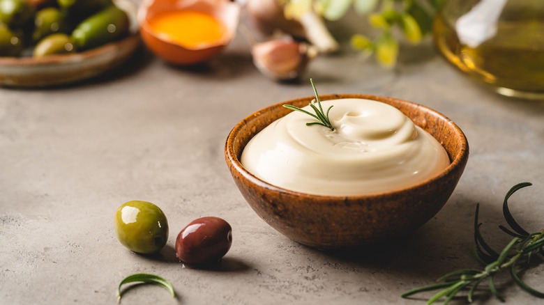 bowl of mayonnaise with olives