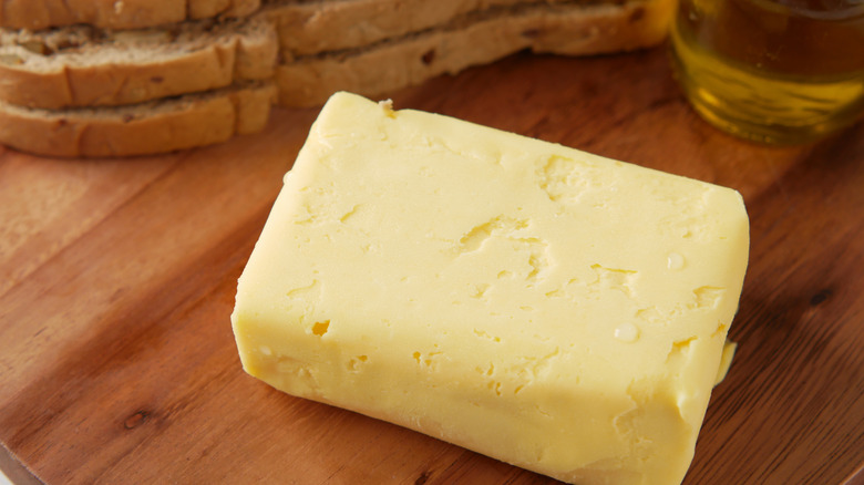Block of butter on wooden table