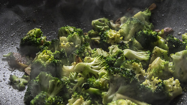 Broccoli frying in wok