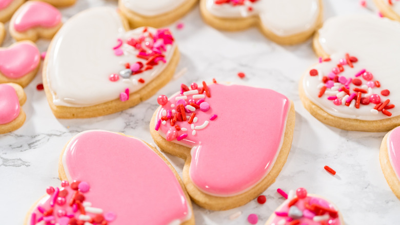Heart cookies decorated with pink and white royal icing
