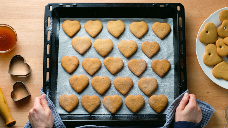 Fresh baked heart cookies on a cooking sheet