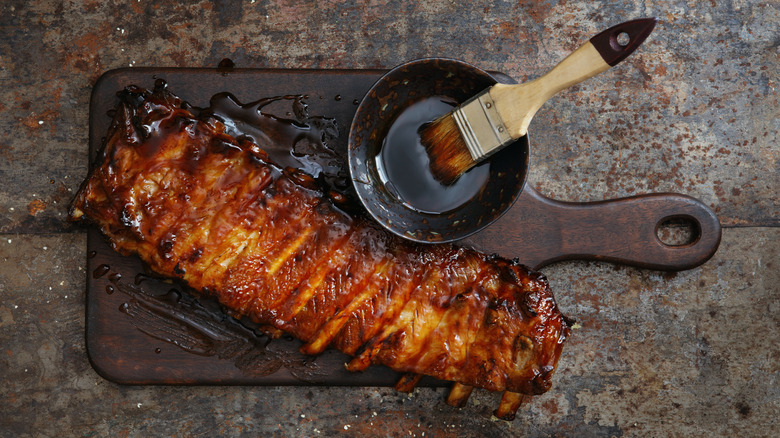 saucy ribs with basting brush