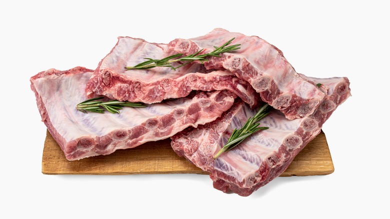 raw pork ribs on board