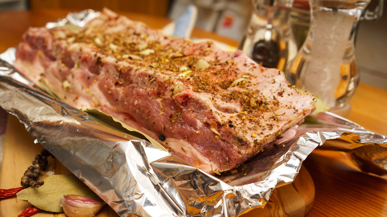 raw ribs over aluminum foil