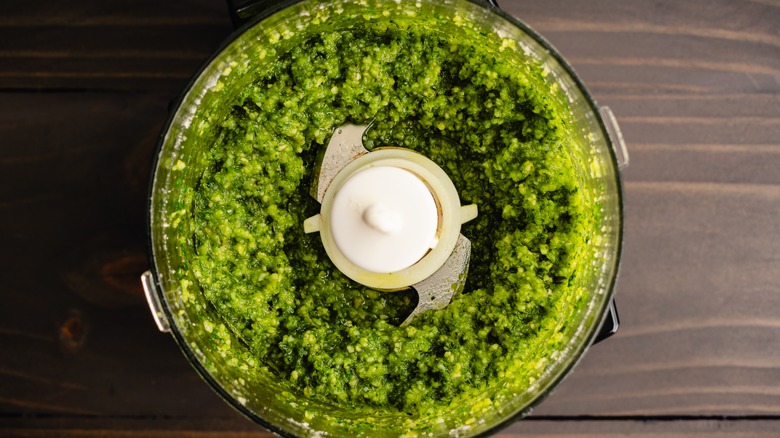 freshly mixed pesto in food processor