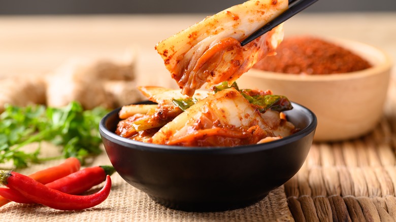 kimchi in small black bowl