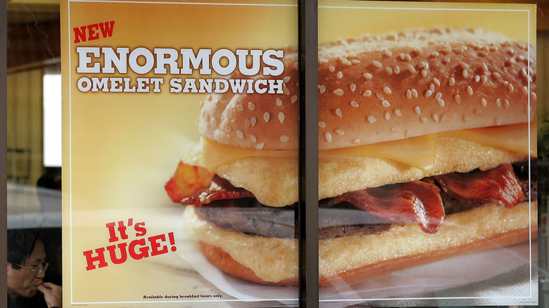 Window signage for Burger King's Enormous Omelet Sandwich