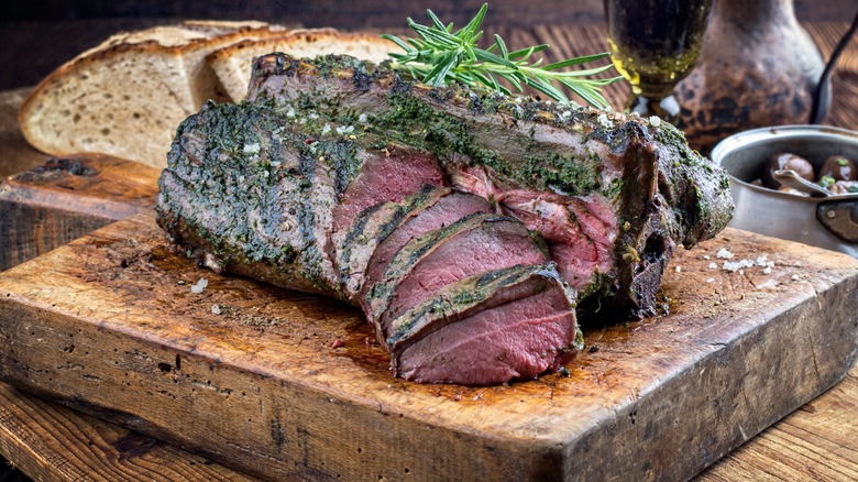 sliced venison on cutting board